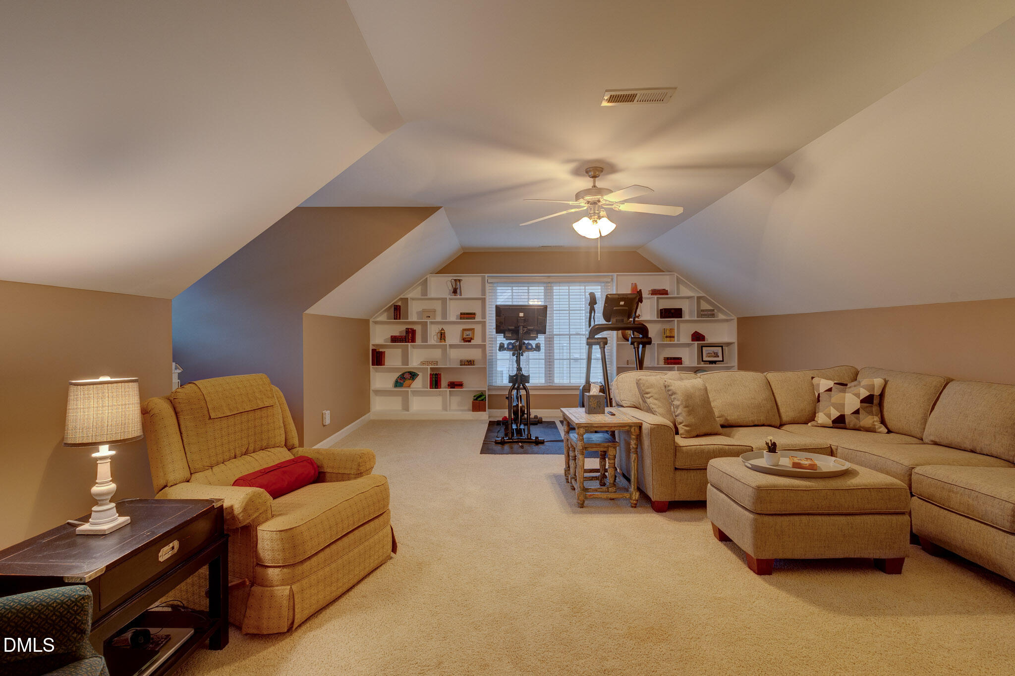 1116 Neuse Ridge Drive Clayton, NC 27527 - Photo 32 of 39 a living room with furniture and a chandelier