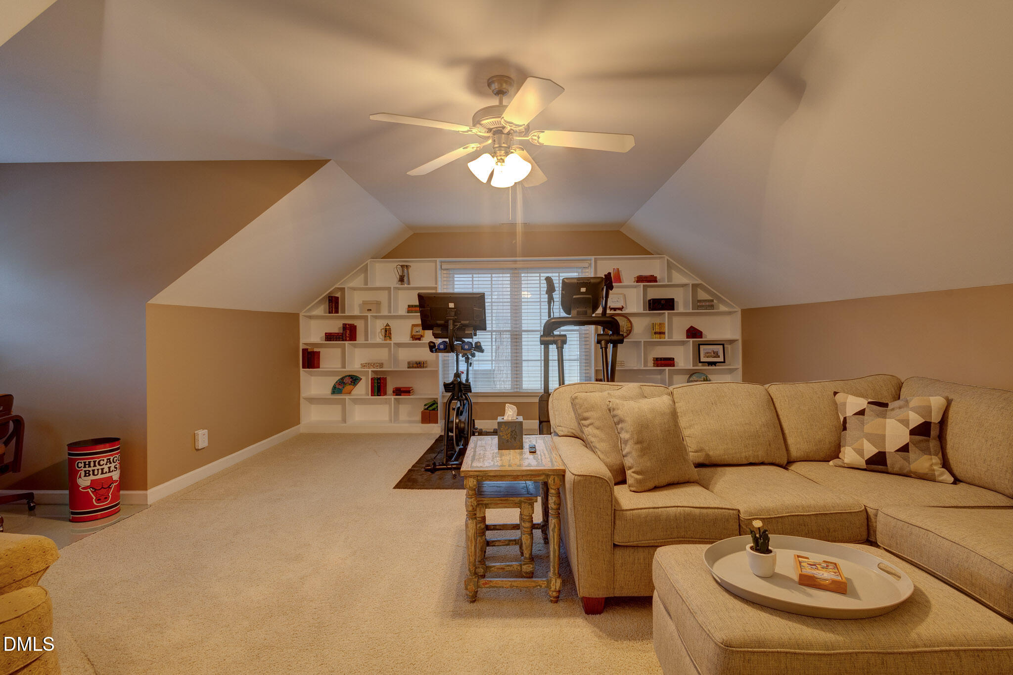 1116 Neuse Ridge Drive Clayton, NC 27527 - Photo 33 of 39 a living room with furniture and a chandelier