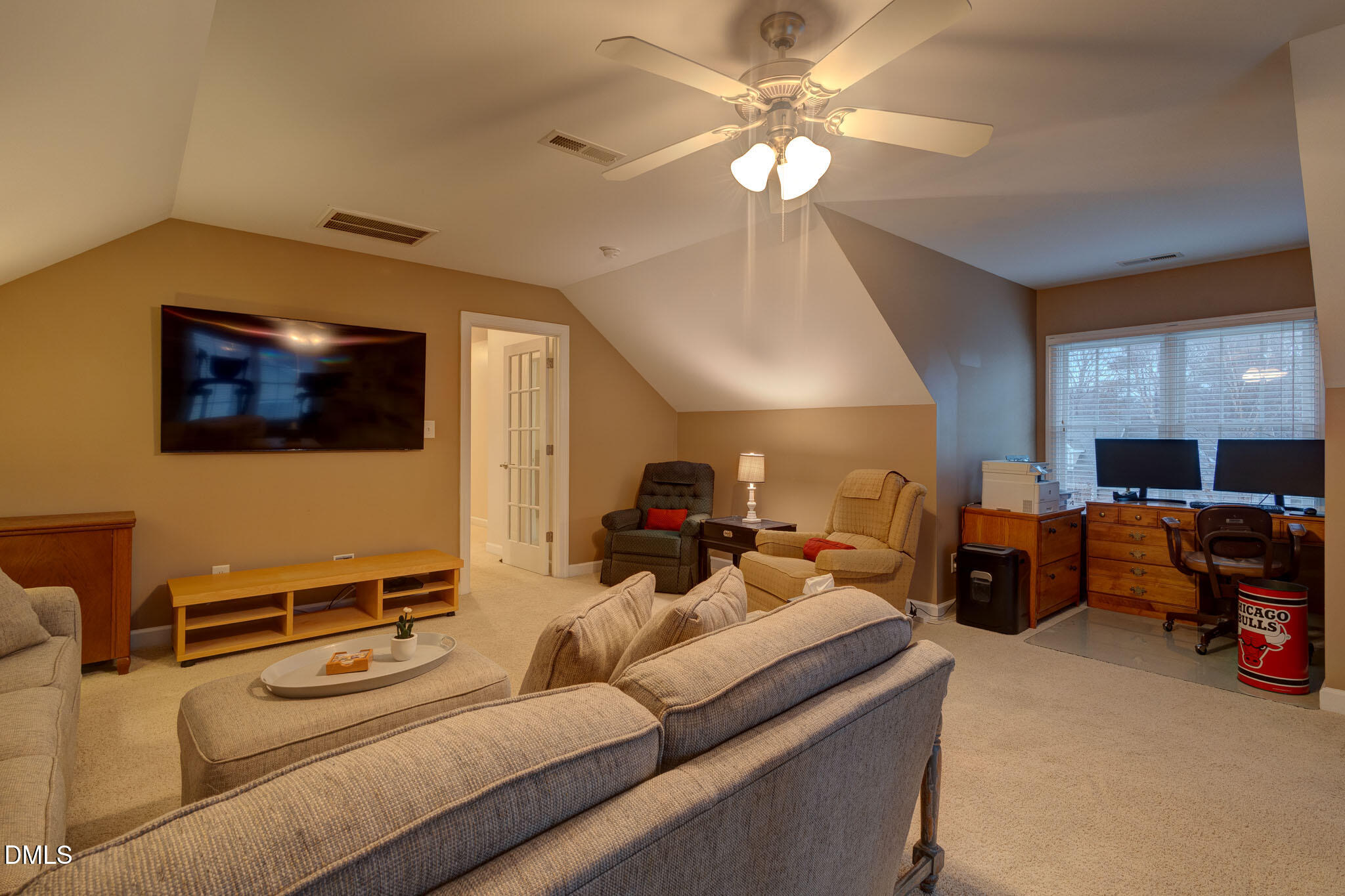 1116 Neuse Ridge Drive Clayton, NC 27527 - Photo 35 of 39 a living room with furniture and a flat screen tv