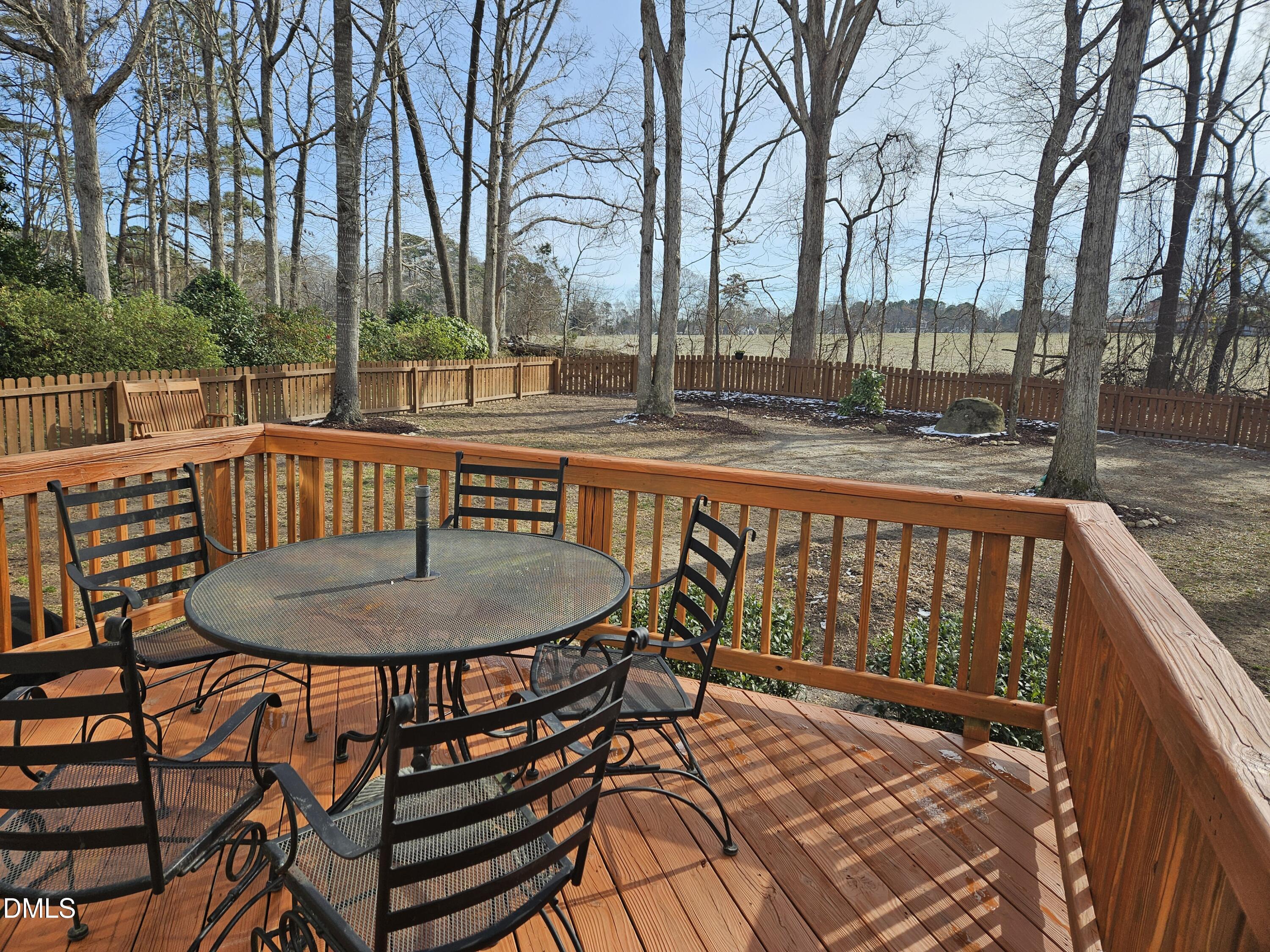 1116 Neuse Ridge Drive Clayton, NC 27527 - Photo 5 of 39 a balcony with table and chairs