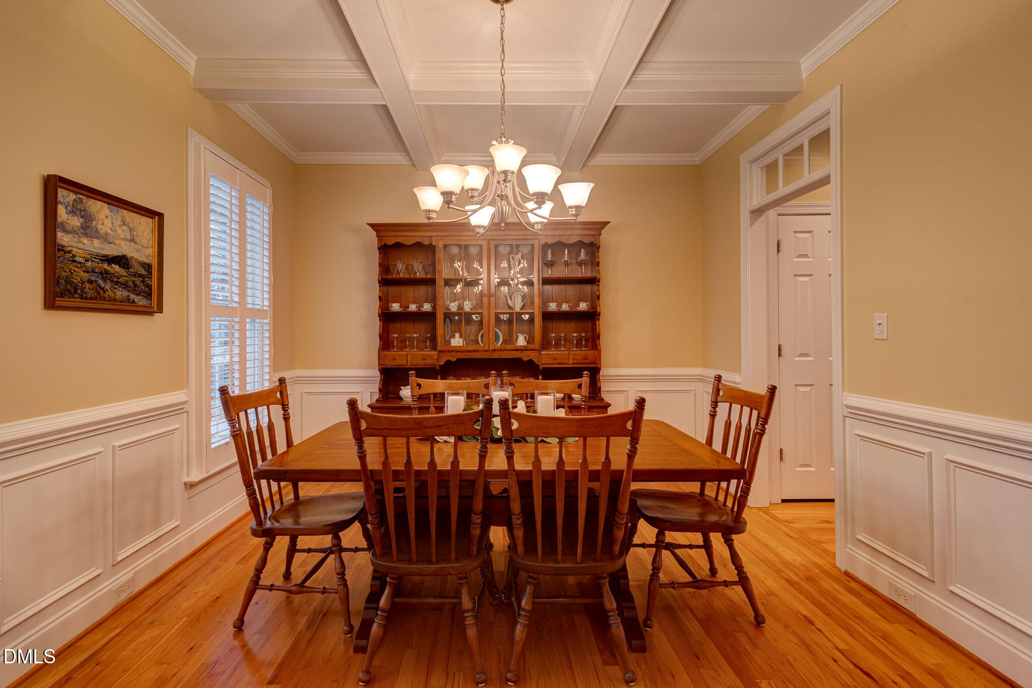 1116 Neuse Ridge Drive Clayton, NC 27527 - Photo 7 of 39 a view of a dining room with furniture a chandelier and wooden floor