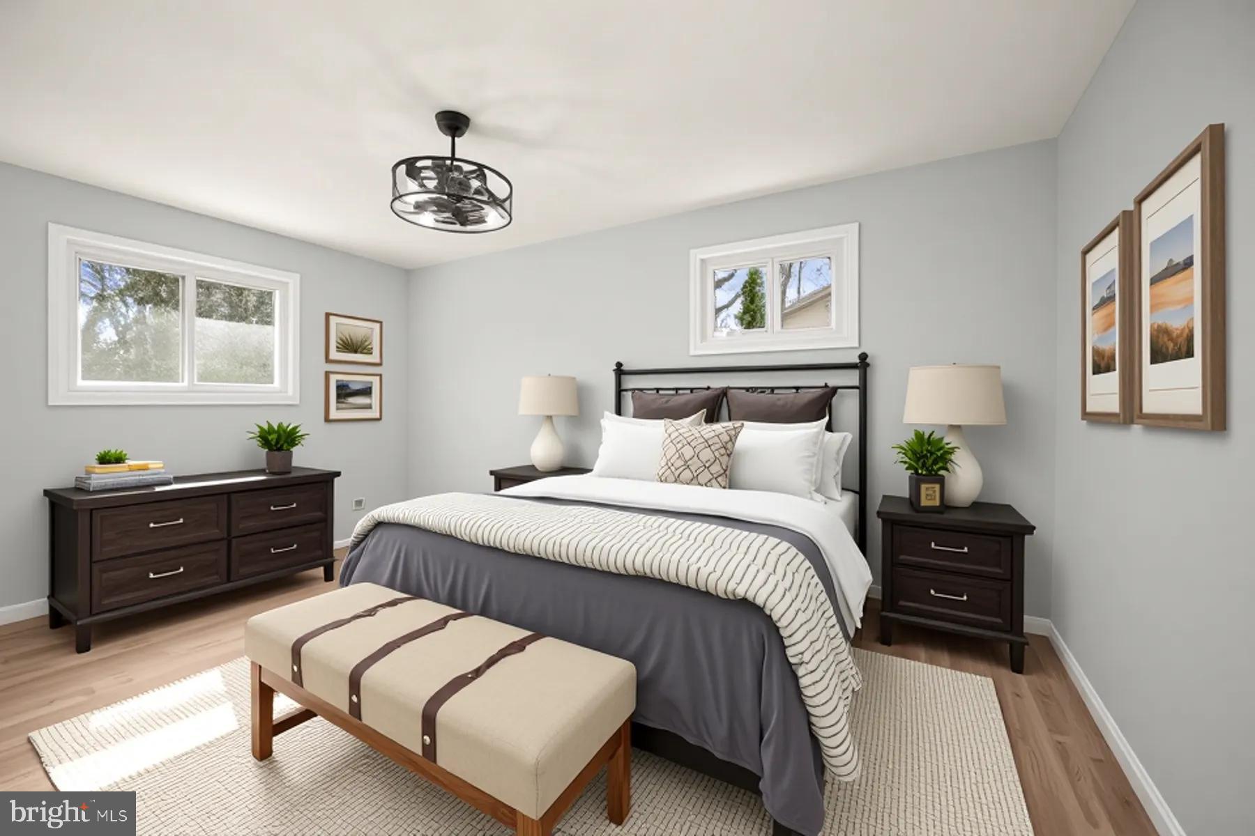 9720 Hedin Drive Silver Spring, MD 20903 - Photo 36 of 79 a bedroom with a bed and a chandelier