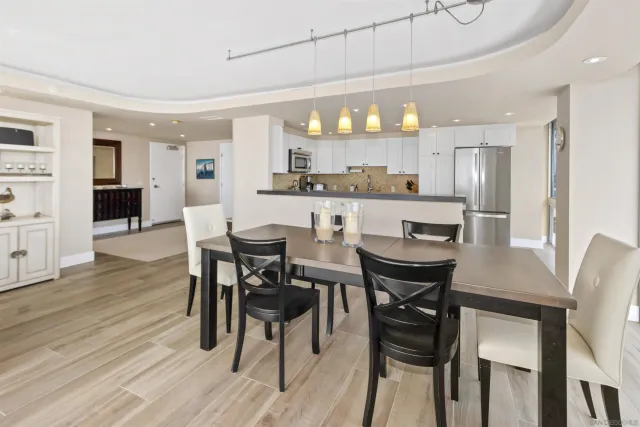 a view of a dining room with furniture and wooden floor