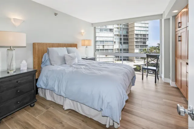 a bedroom with a large bed and a table