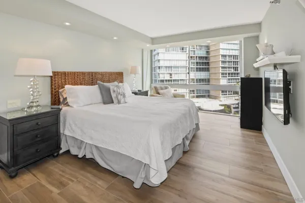a bed room with a bed and a night stand