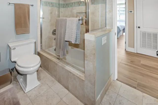 a bathroom with a shower and a toilet