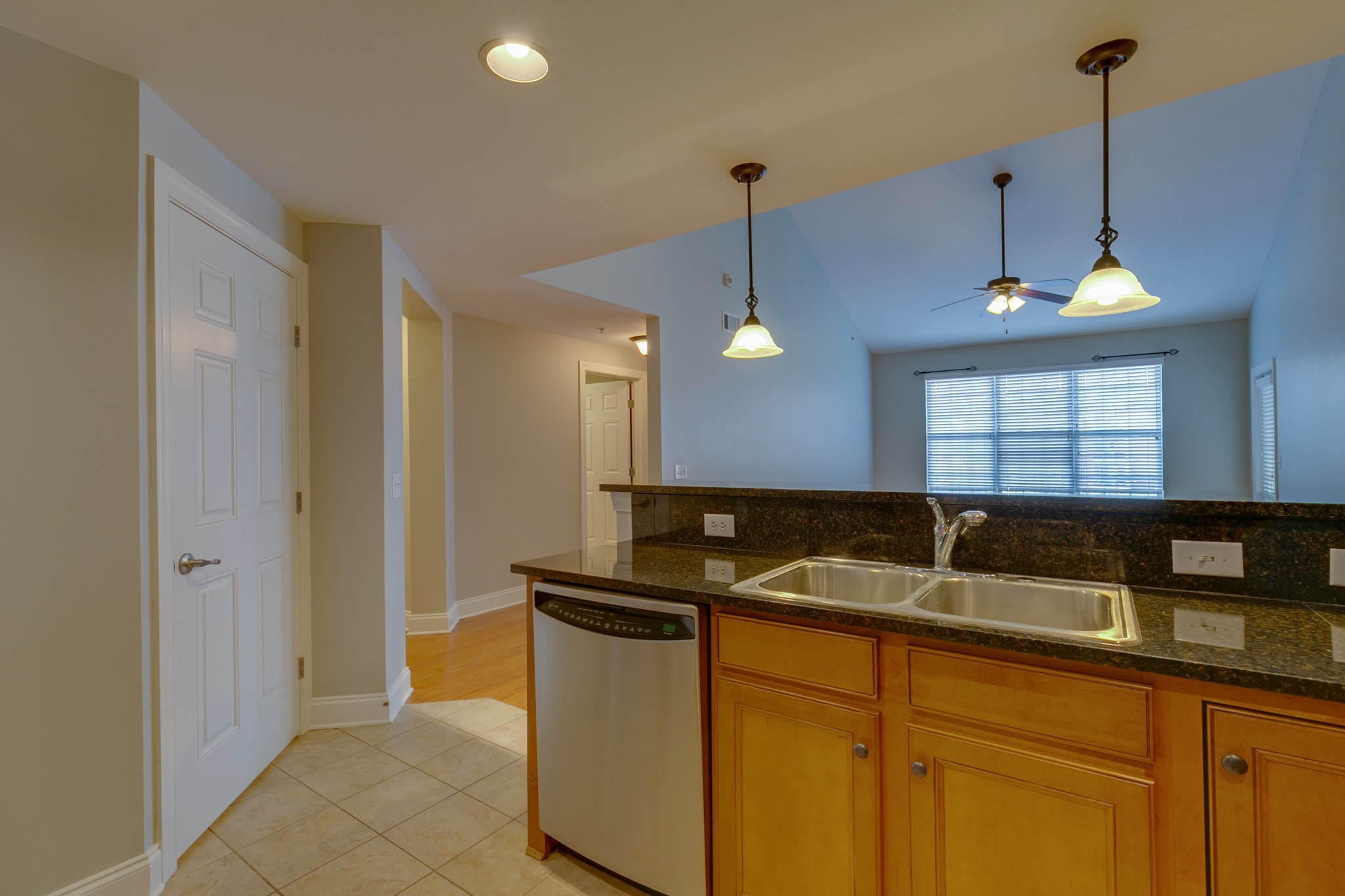 3201 Aspen Grove Drive, Unit B9 Franklin, TN 37067 - Photo 19 of 37 a kitchen with granite countertop a sink a counter and cabinets