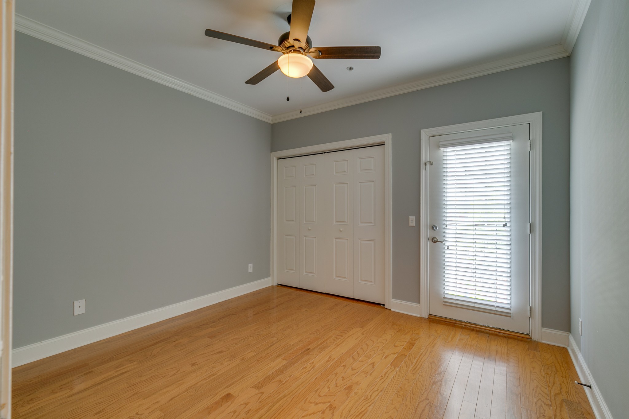 3201 Aspen Grove Drive, Unit B9 Franklin, TN 37067 - Photo 22 of 37 a view of an empty room with a window and wooden floor