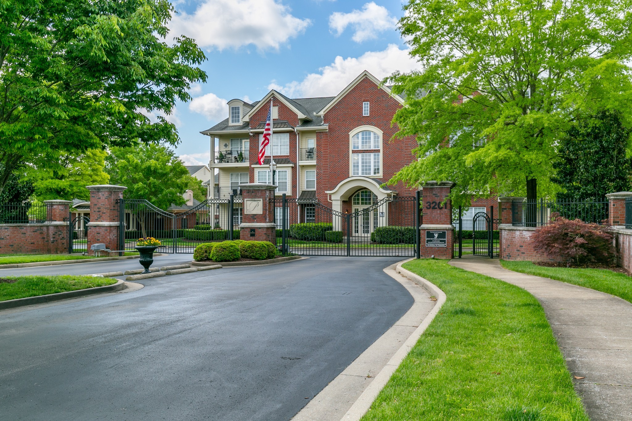 3201 Aspen Grove Drive, Unit B9 Franklin, TN 37067 - Photo 3 of 37 a front view of a house with a yard