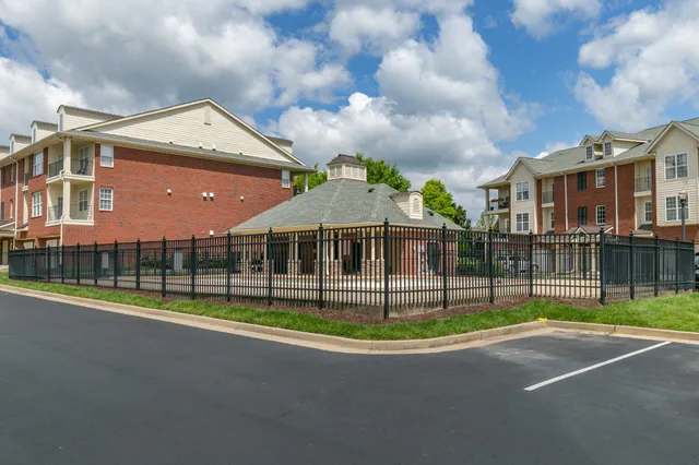 a front view of building with yard and green space