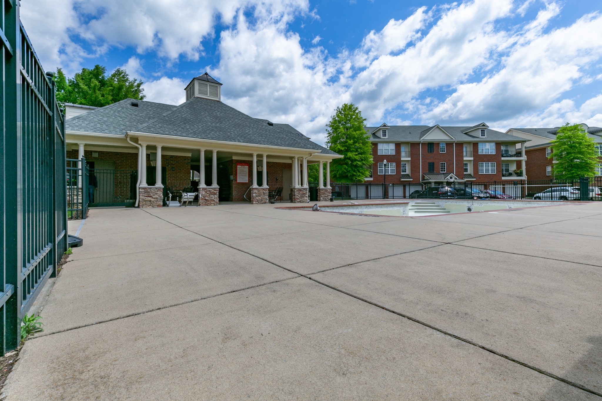 3201 Aspen Grove Drive, Unit B9 Franklin, TN 37067 - Photo 34 of 37 a front view of a house with a garden and trees