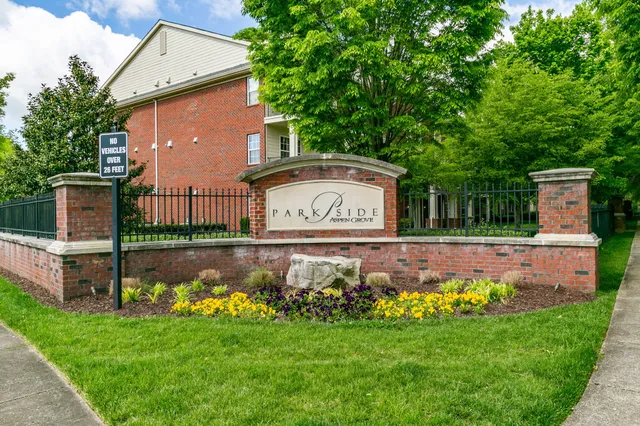 a view of a wooden house with a big yard