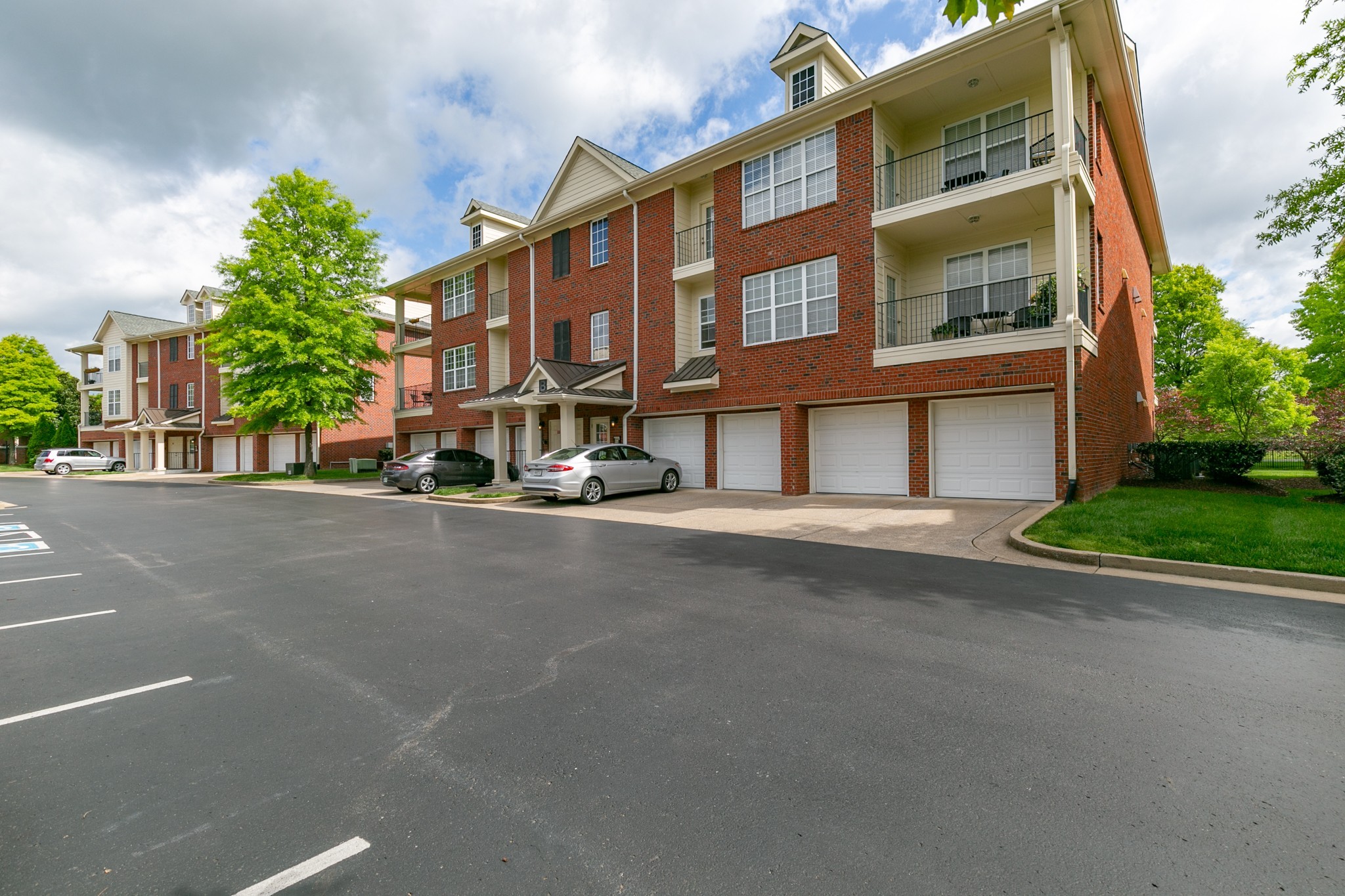 3201 Aspen Grove Drive, Unit B9 Franklin, TN 37067 - Photo 5 of 37 a view of a street with a building in the background