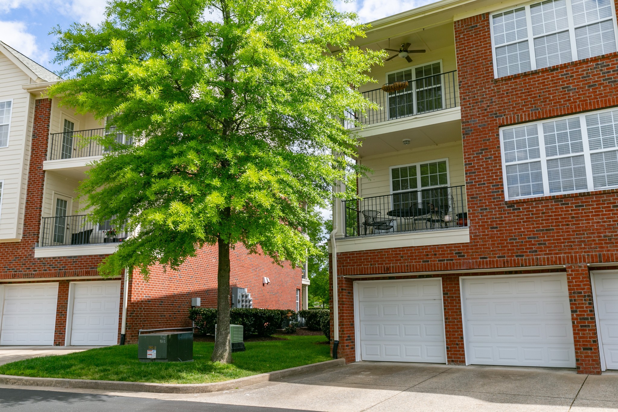3201 Aspen Grove Drive, Unit B9 Franklin, TN 37067 - Photo 6 of 37 a house that has a tree in front of the house