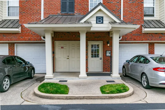 a front view of a house with parking space