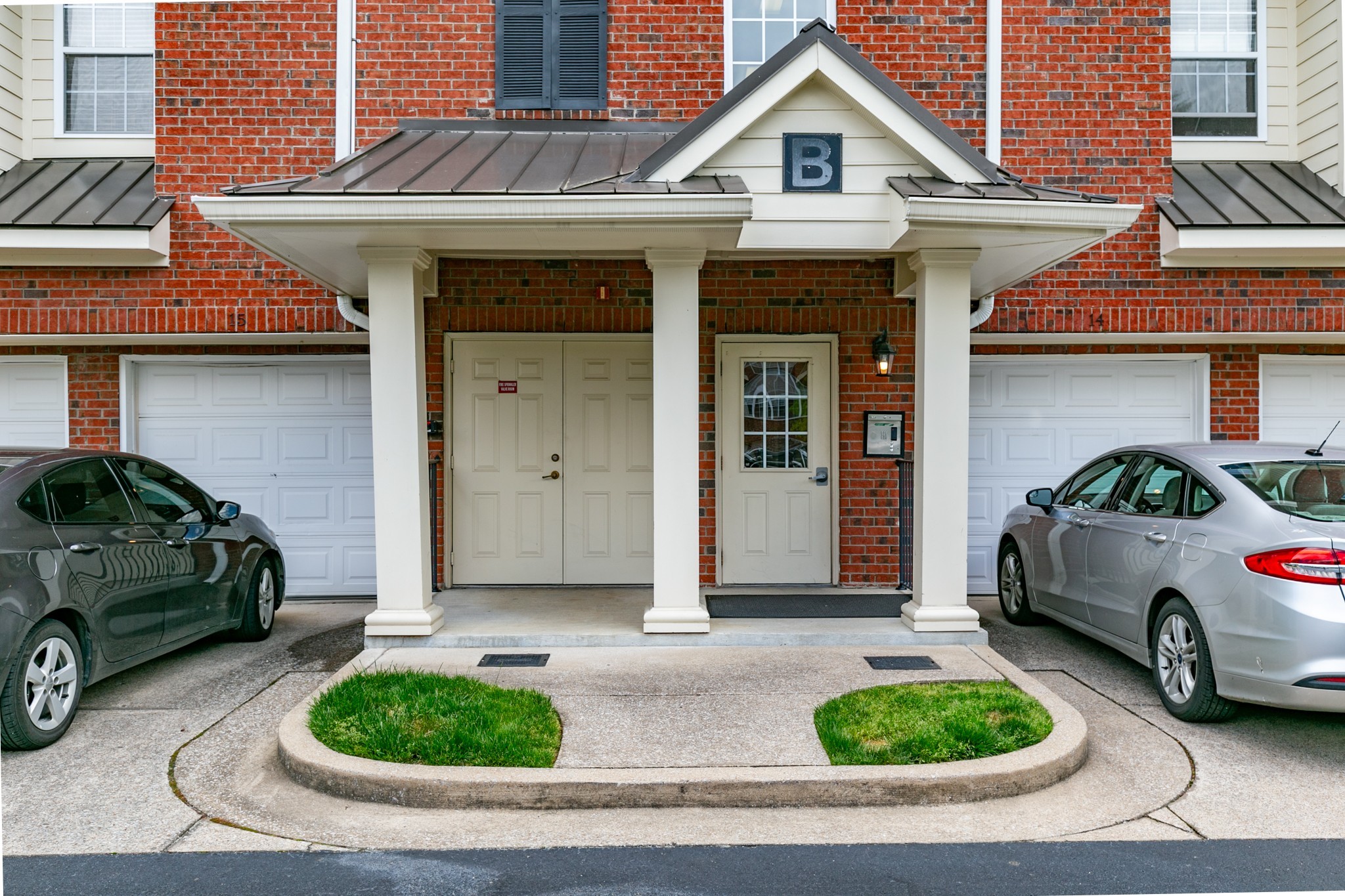 3201 Aspen Grove Drive, Unit B9 Franklin, TN 37067 - Photo 7 of 37 a front view of a house with parking space