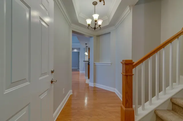 a view of a hallway with a chandelier