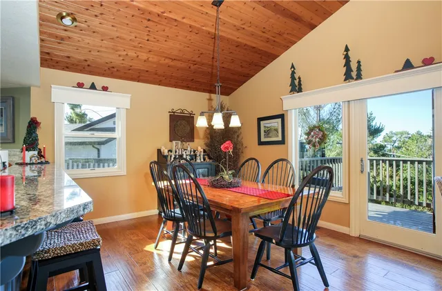 a balcony with furniture and wooden floor