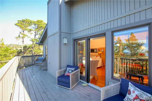 a view of a balcony with wooden fence