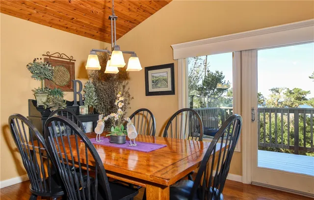 a balcony with furniture and wooden floor