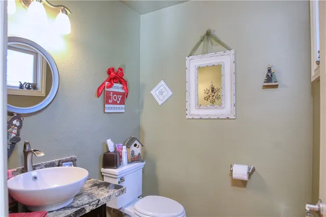 a view of a livingroom with wooden floor and windows