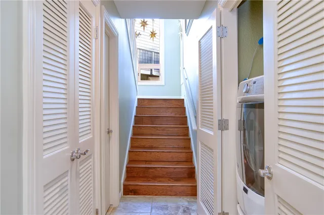 a bedroom with a bed and a view of walk in closet