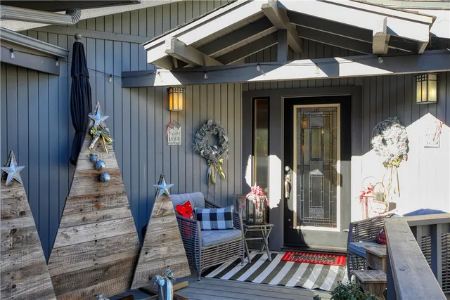 a view of an entryway with wooden floor