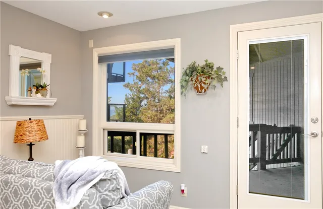 a bathroom with a bathtub and a window