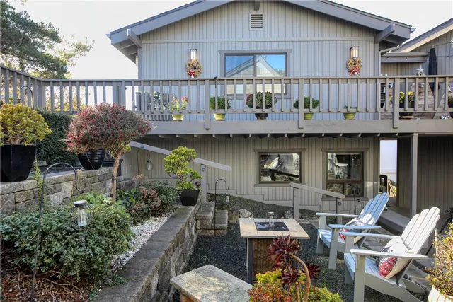 a front view of a house with outdoor seating