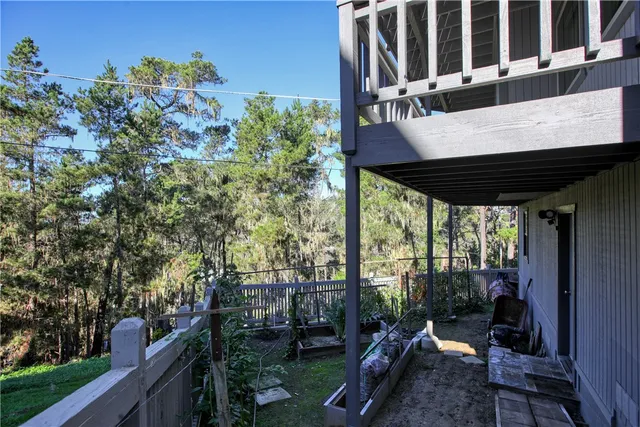 a view of balcony with wooden floor