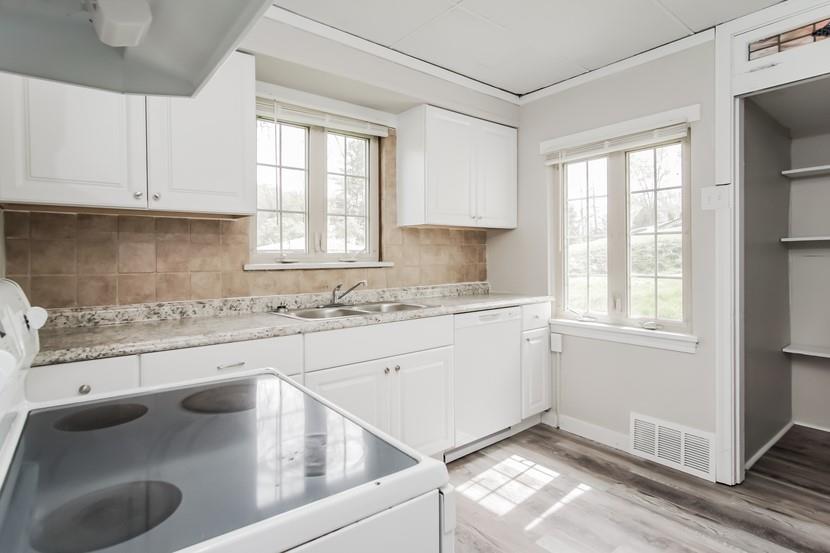 260 Ohio Street Monroeville, PA 15146 - Photo 3 of 13 a kitchen with granite countertop white cabinets and white appliances