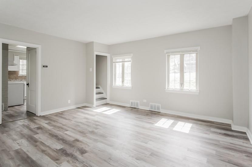 260 Ohio Street Monroeville, PA 15146 - Photo 6 of 13 a view of an empty room with wooden floor and a window