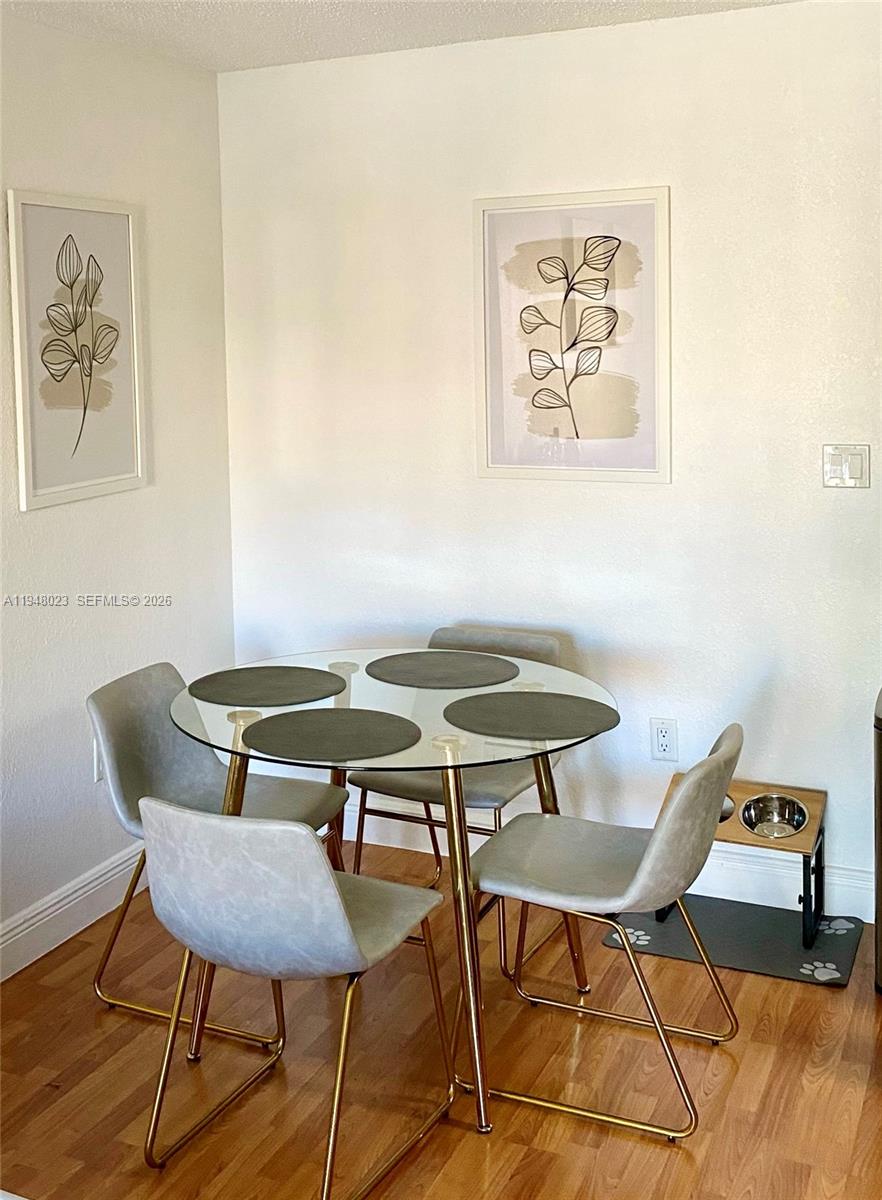 15680 Southwest 106th Lane, Unit 804 Miami, FL 33196 - Photo 16 of 32 a view of a room with furniture and wooden floor