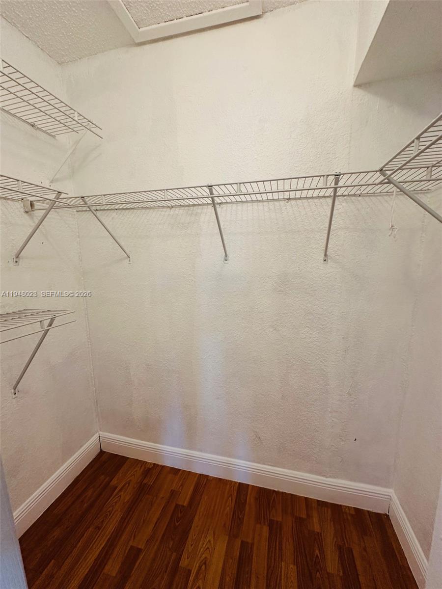 15680 Southwest 106th Lane, Unit 804 Miami, FL 33196 - Photo 25 of 32 a view of a room with racks on the wall