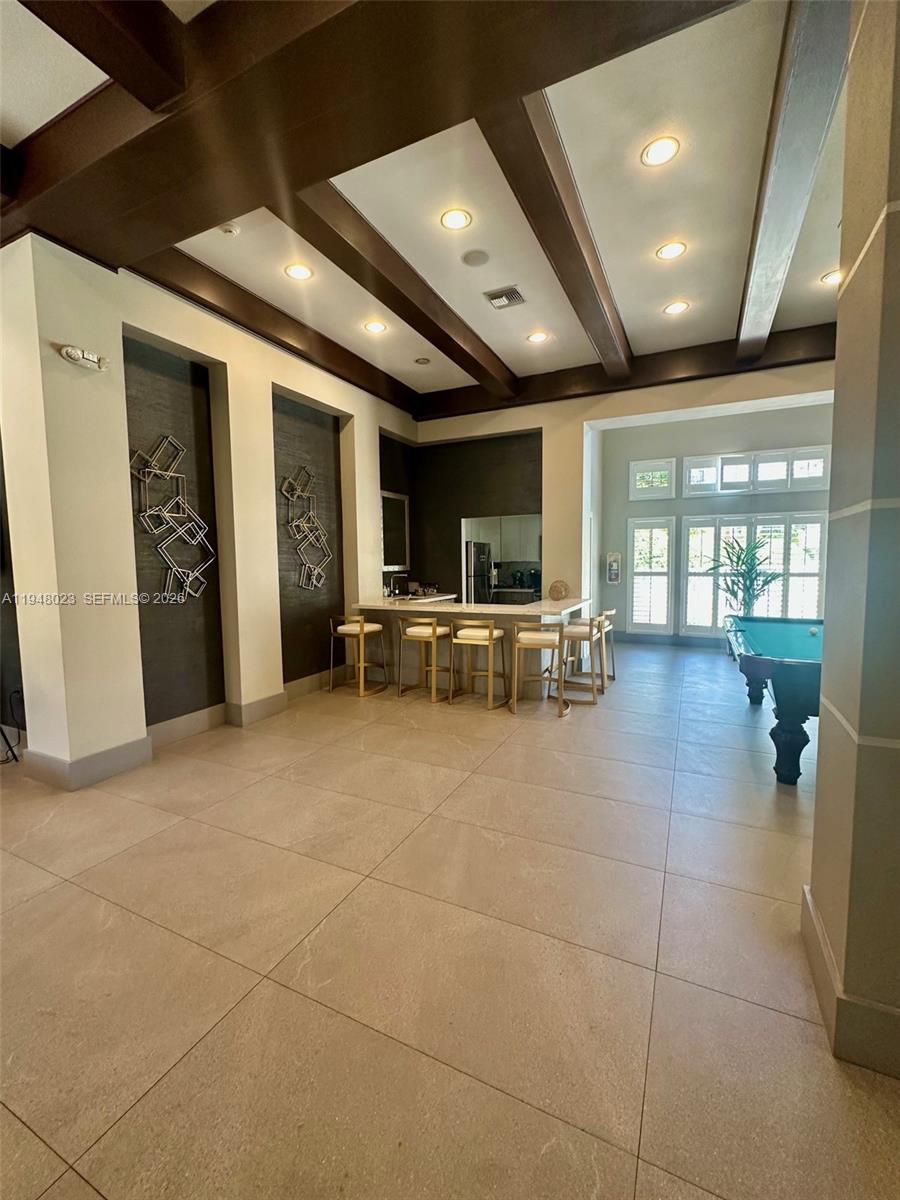 15680 Southwest 106th Lane, Unit 804 Miami, FL 33196 - Photo 3 of 32 a lobby with furniture and window
