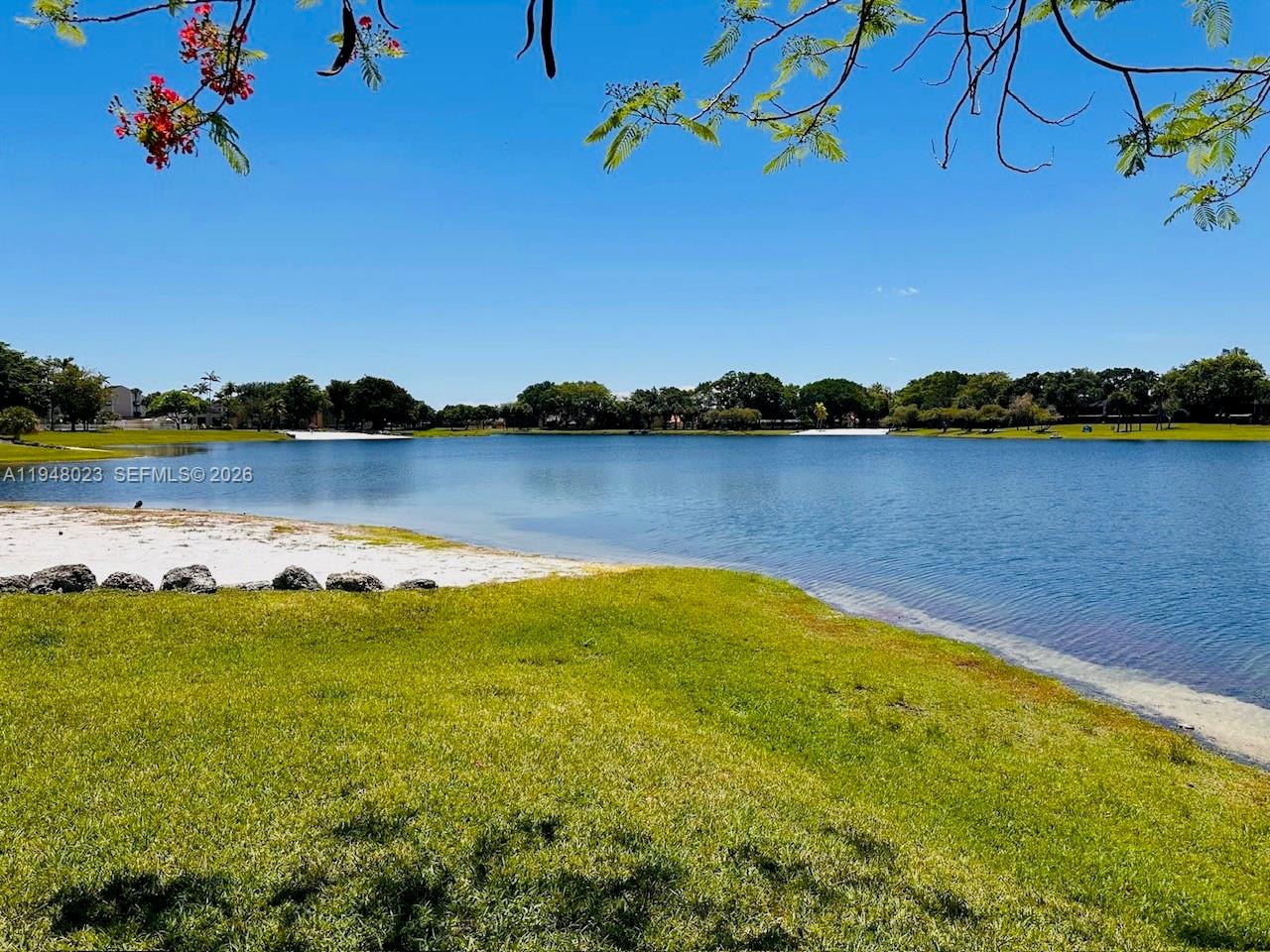 15680 Southwest 106th Lane, Unit 804 Miami, FL 33196 - Photo 31 of 32 a view of a lake with a mountain view