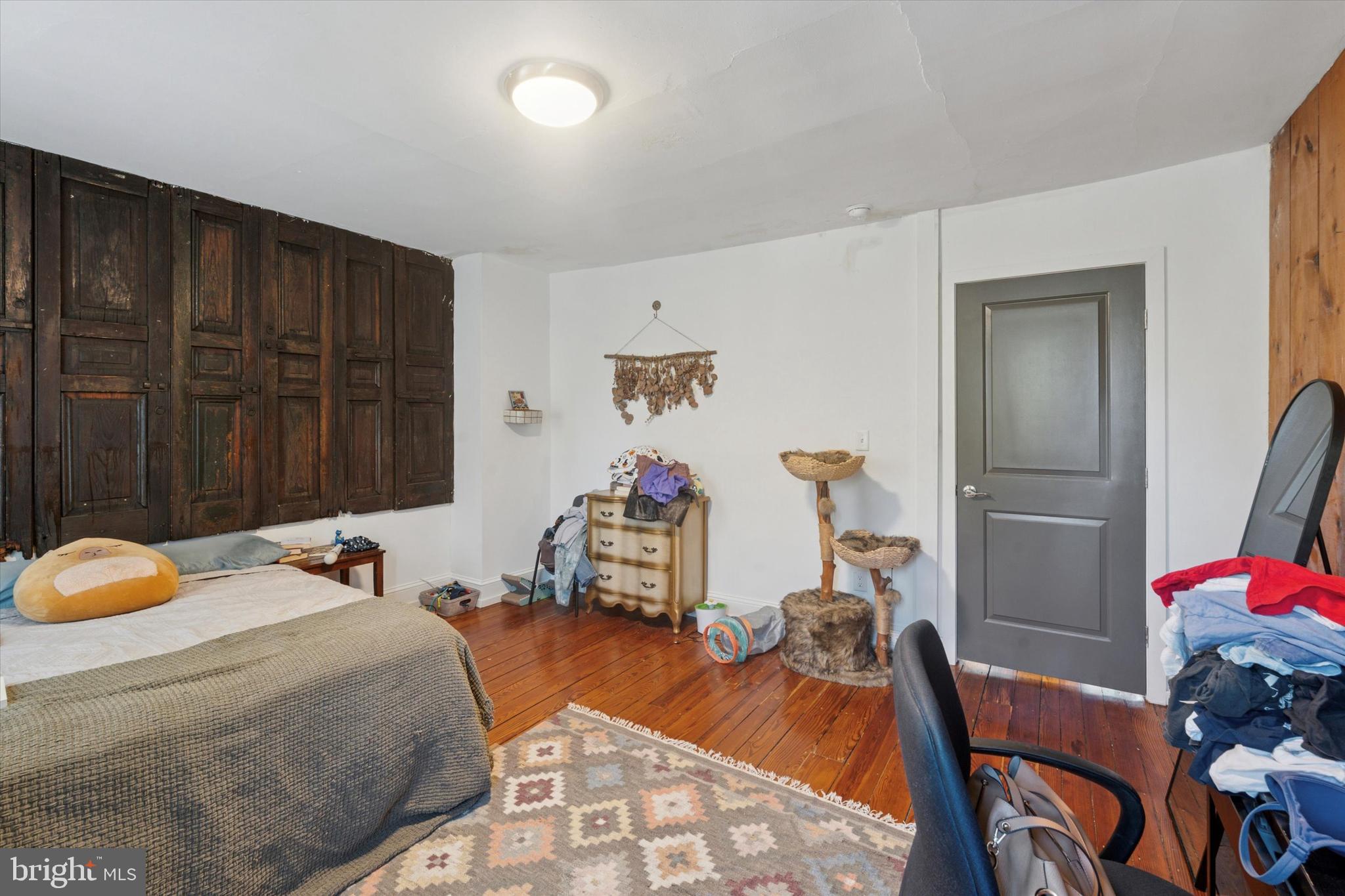 3816 Spring Garden Street Philadelphia, PA 19104 - Photo 17 of 30 a bedroom with bed and a table