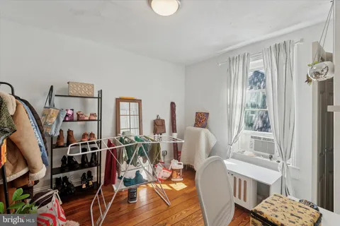 a view of a livingroom with furniture and wooden floor