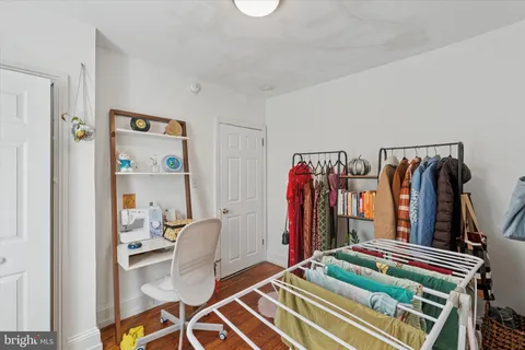 a bed room with a bed and a chair