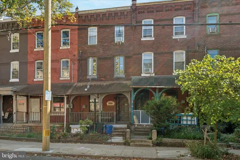 a front view of a building with garden