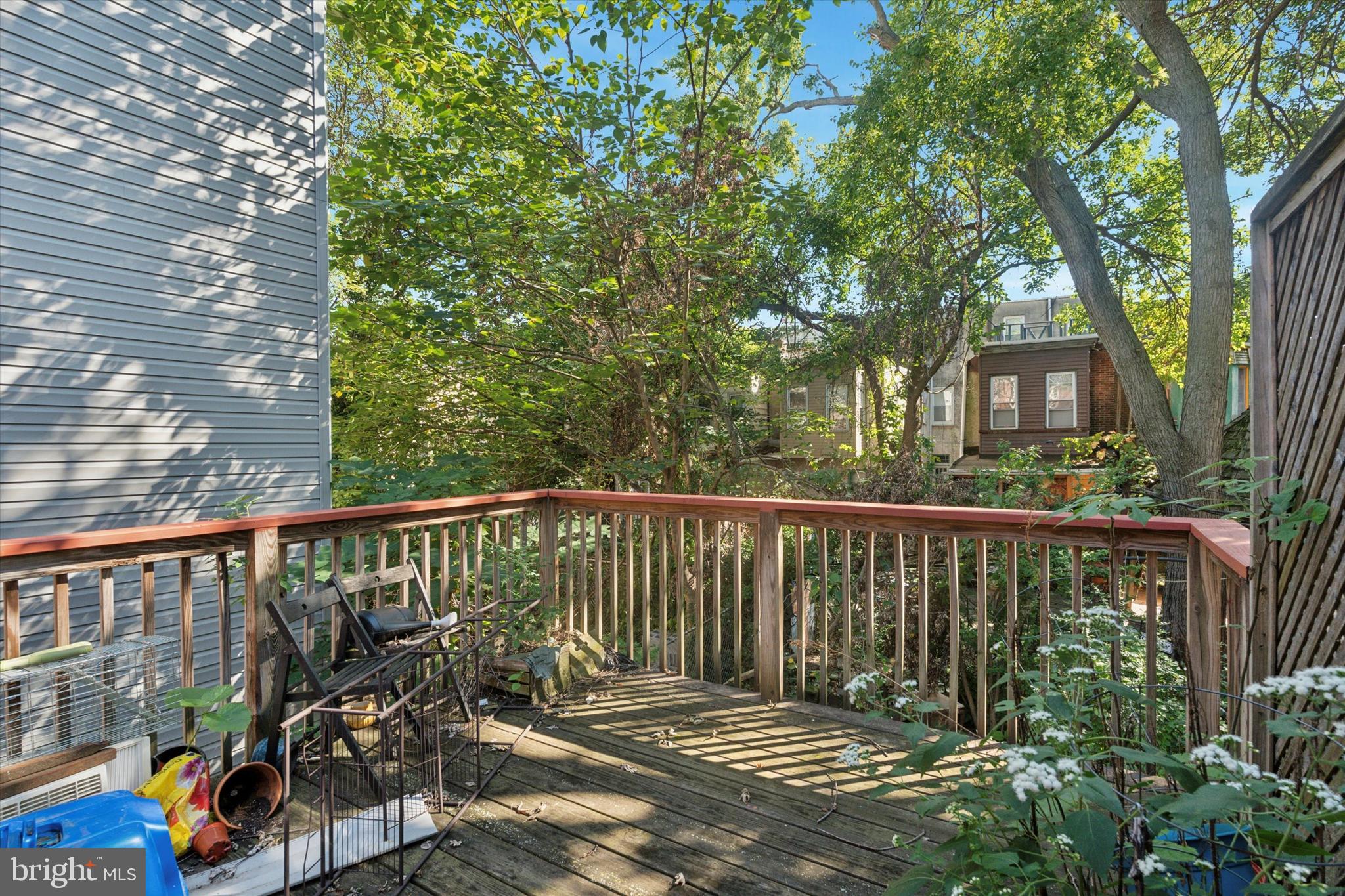 3816 Spring Garden Street Philadelphia, PA 19104 - Photo 6 of 30 a view of a balcony with chairs and wooden fence