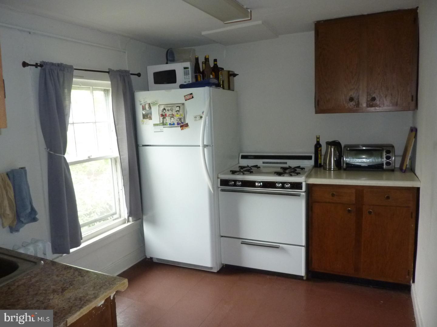75 Patton Avenue, Unit 2 Princeton, NJ 08540 - Photo 5 of 6 a kitchen with a refrigerator stove and sink