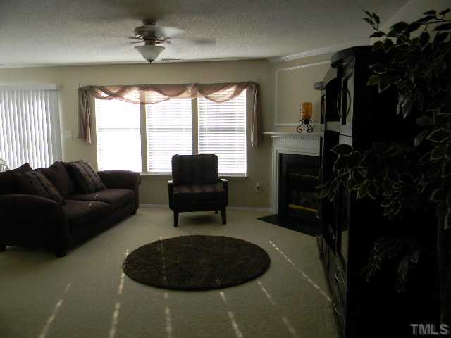 Another view of the bright, comfortable living/family room-