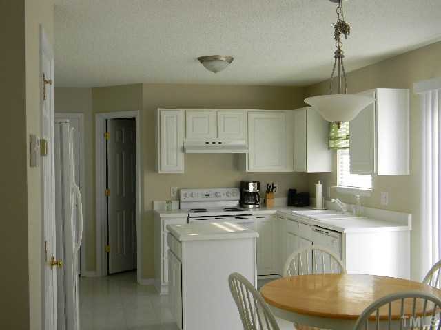 Sparkling clean eat-in kitchen.  Refrigerator conveys.