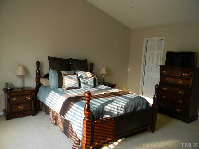 Enjoy the spacious master bedroom and master bath. Bedroom has cathedral ceiling.