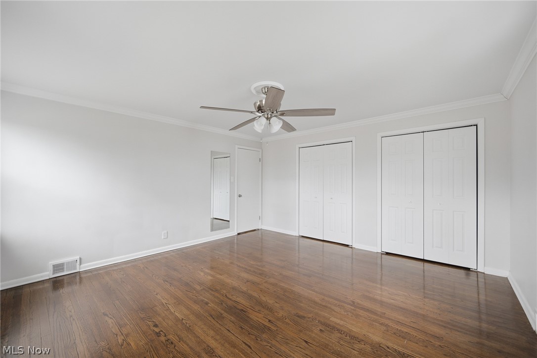 3722 Lindholm Road Shaker Heights, OH 44120 - Photo 25 of 34 This room features polished hardwood flooring, a ceiling fan with integrated lighting, and two sets of bi-fold closet doors