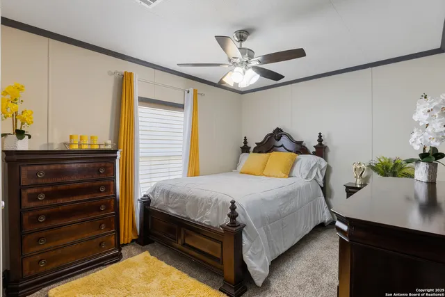 a bedroom with a bed and a table