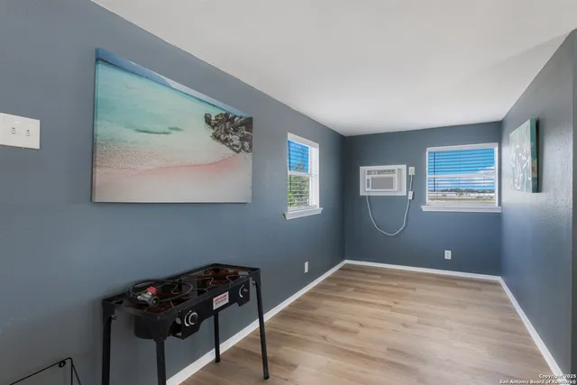 a bedroom with a bed and a black furniture