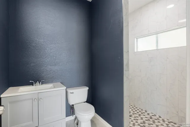 a bathroom with a sink and a toilet