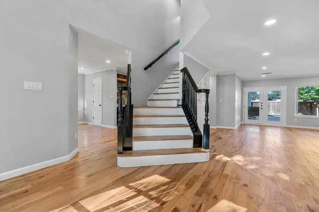 a view of entryway with wooden floor and stairs
